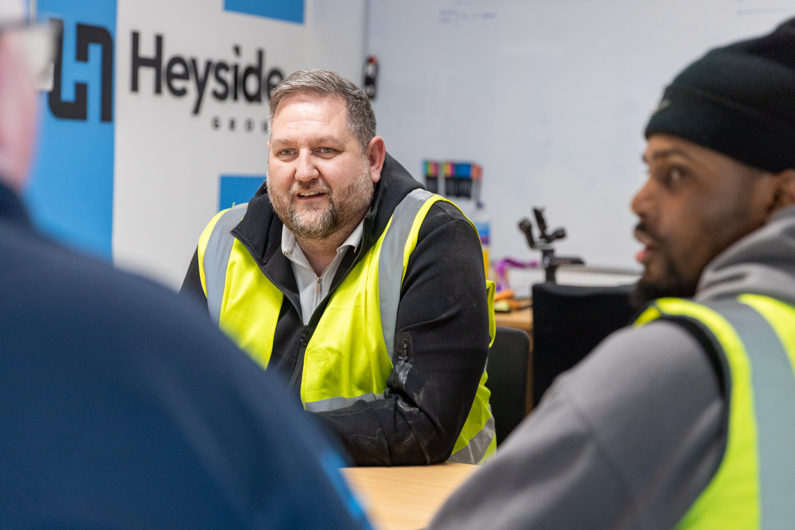 Heyside Group team meeting with client about injection moulding project