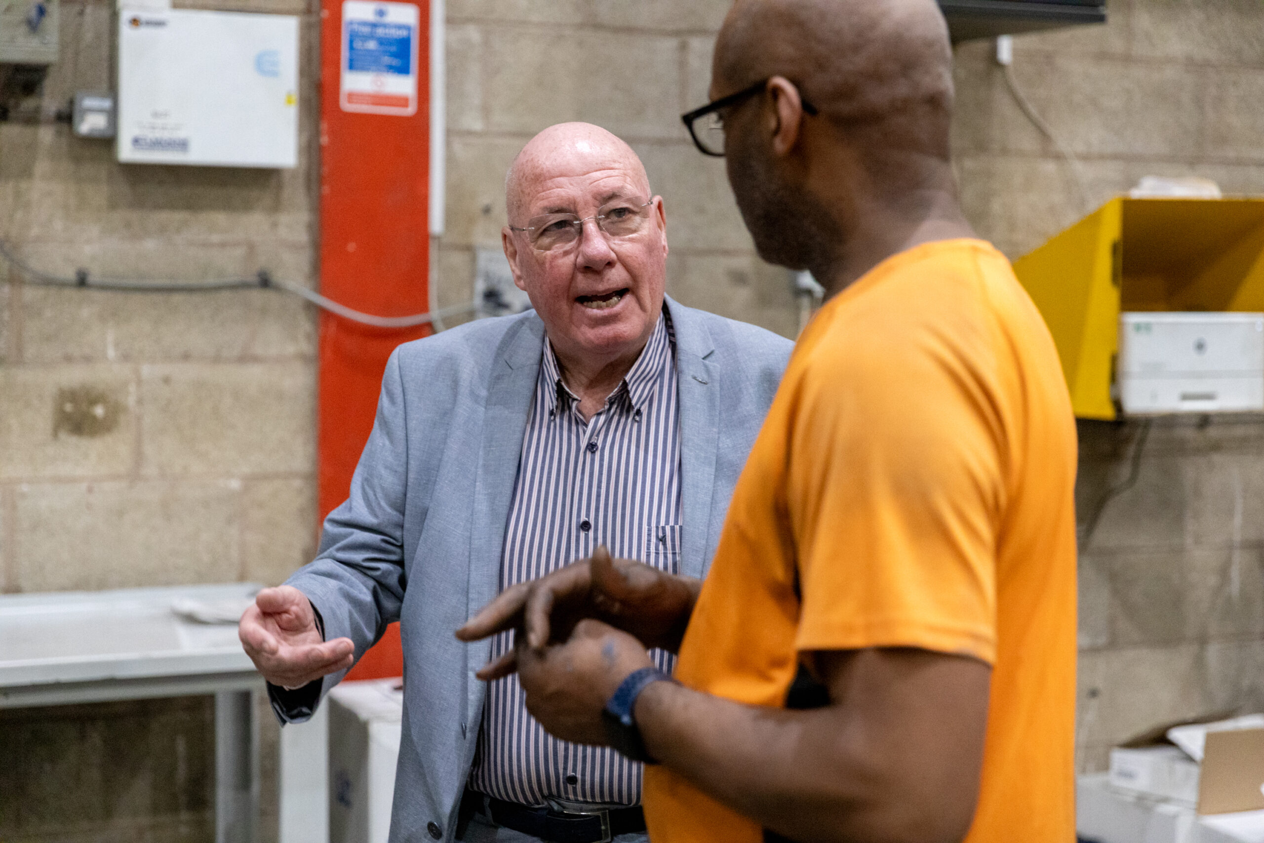 Melvyn Pryce, founder of Heyside Group, with a member of the Heyside team