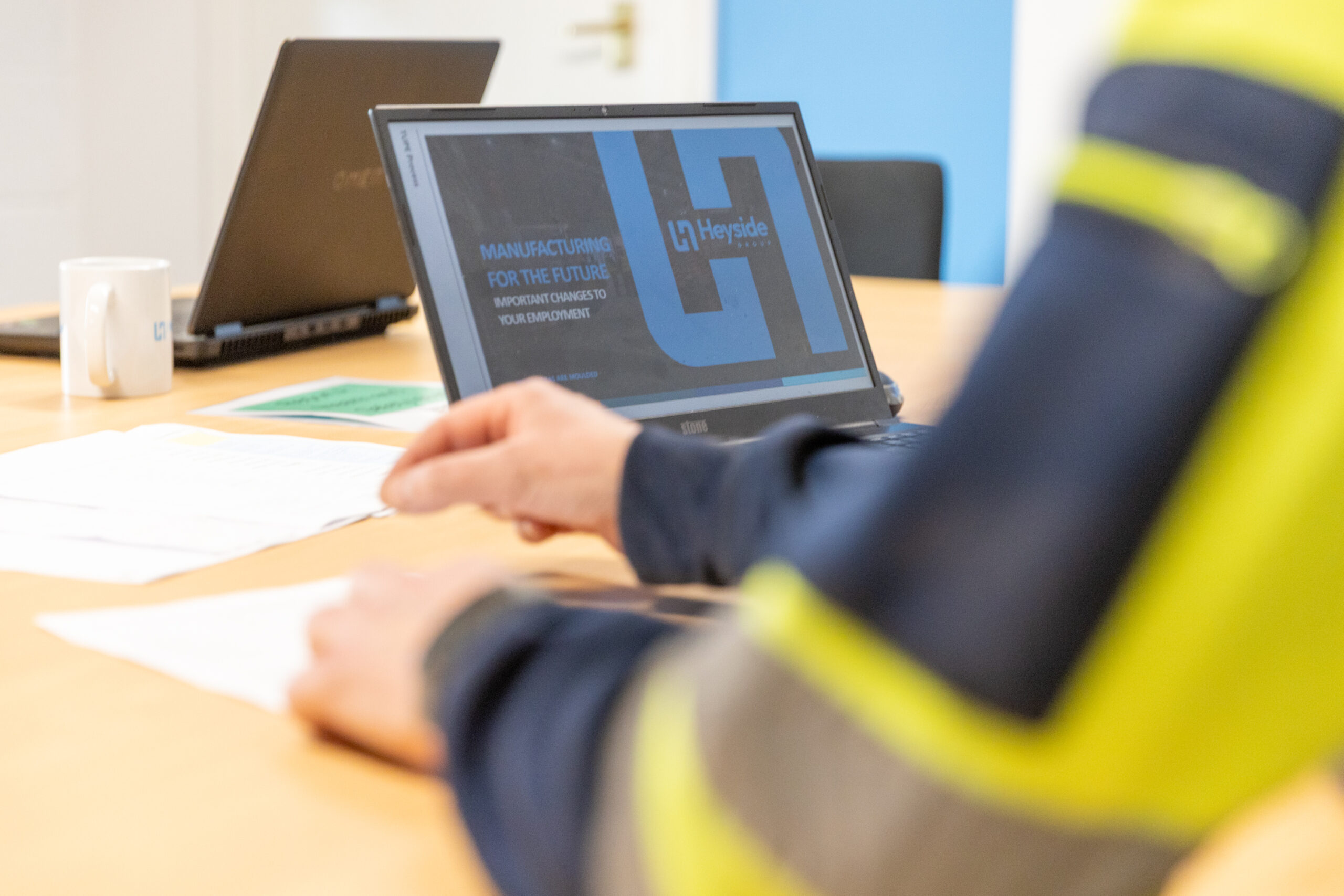 Laptop displaying Heyside Group logo